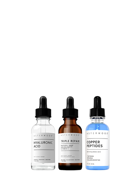 Asterwood Bounce Back Trio: Hyaluronic Acid serum, Triple Repair amber serum, and Copper Peptides blue serum lined up on white.
