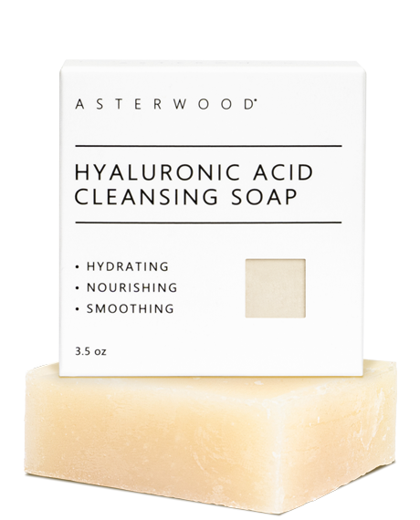 Asterwood Hyaluronic Acid Cleansing Soap 3.5 oz cream bar in front of its white carton labeled hydrating, nourishing, smoothing.