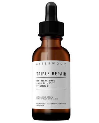 Asterwood Triple Repair Serum 1 fl oz amber glass bottle with black dropper, an anti-aging serum with Matrixyl 3000, Argireline, Vitamin C and Hyaluronic Acid.