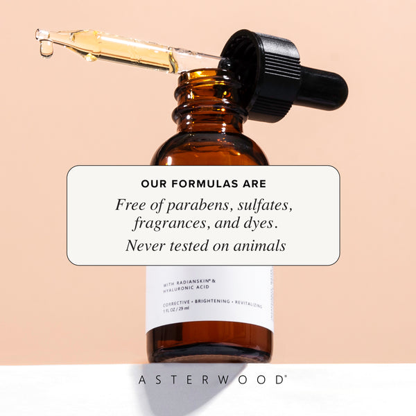 Amber Dark Spot Corrector bottle on peach background with dropper showing golden serum and callout that formulas are paraben, sulfate, fragrance, dye free, cruelty-free.