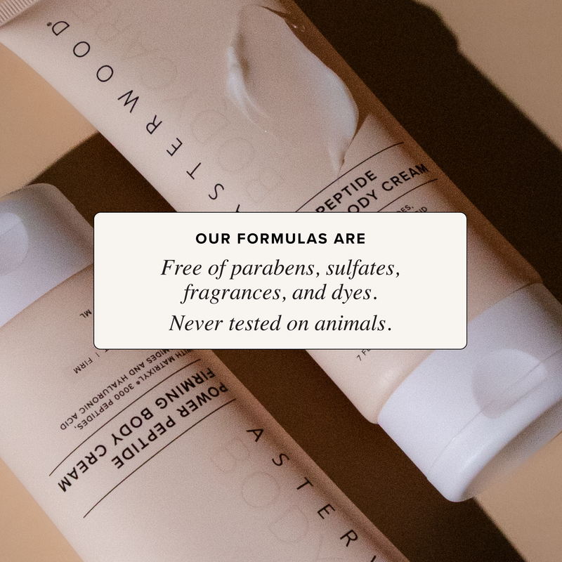 Two crossed Power Peptide Body Cream tubes with cream squeeze, callout that Asterwood formulas are paraben, sulfate, fragrance, dye free and cruelty-free.
