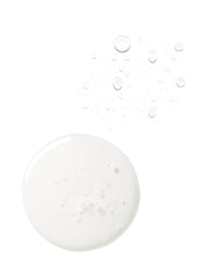 Macro swatch of milky Triple Ceramide serum droplet with surrounding clear hypochlorous mist beads, showing the two textures of the Barrier Boost Duo.
