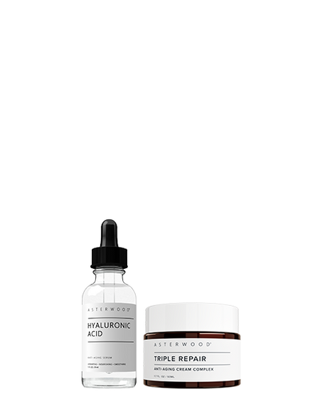 Asterwood Dew It Up Bundle: Hyaluronic Acid serum dropper bottle next to Triple Repair Anti-Aging Cream Complex amber jar.