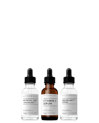 Asterwood Fine Line Trio on white: the Matrixyl 3000 + Argireline serum, amber Vitamin C Serum, and Argireline Serum, all dropper bottles.