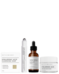 Asterwood Skin Rescue Routine: Hyaluronic Acid Cleansing Soap box, HA Eye Serum pen, Triple Repair amber serum, and HA Anti-Aging Moisturizer jar.