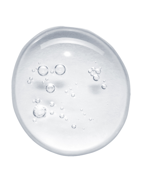 Top-down macro of a clear Asterwood Argireline Serum droplet with tiny bubbles on white, showing the lightweight peptide texture.