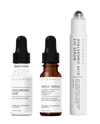 Travel-size trio from the Skincare Essentials Set: HA serum, Triple Repair amber serum, and HA Eye Serum roller pen.