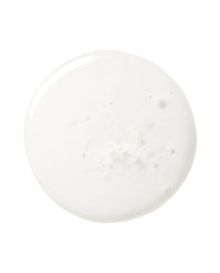 Macro top-down swatch of milky Triple Ceramide Barrier Serum on white showing the airy ceramide texture.