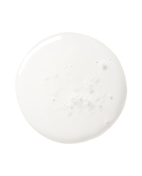 Macro top-down swatch of milky Triple Ceramide Barrier Serum on white showing the airy ceramide texture.