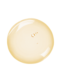 Top-down macro of a pale-gold Triple Repair serum droplet on white showing the smooth peptide and vitamin C blend.