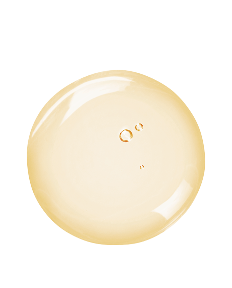 Top-down macro of a pale-gold Triple Repair serum droplet on white showing the smooth peptide and vitamin C blend.