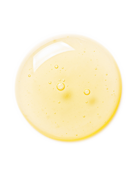 Top-down macro of a golden-yellow Vitamin C Serum droplet on white showing the bright vitamin C texture.