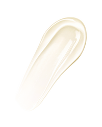 Macro swatch of the soft ivory Volulip lip treatment balm in a smooth stroke on white.